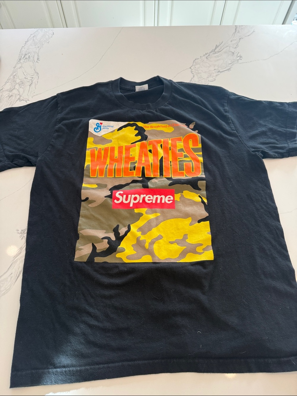 Authentic Supreme Black Tee with Yellow Camo Wheaties Graphic